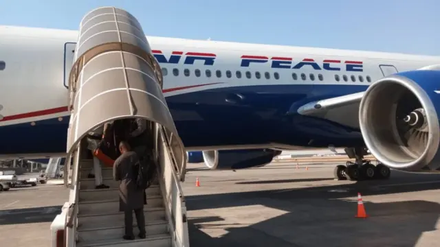 Nigerians wey dey return from South Africa dey board Air Peace