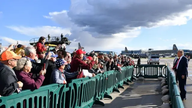 Mr Trump speaks to supporters after landing in Minneapolis