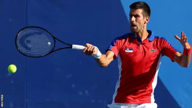 Novak Djokovic returns a ball in his third-round match at the Tokyo Olympics