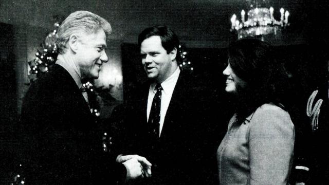 White House intern Monica Lewinsky meeting President Bill Clinton at a White House Christmas party in 1996