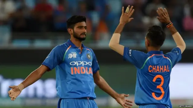 ndia's cricketer Khaleel Ahmed (L) and Yuzvendra Chahal celebrate after he dismissed Hong Kong batsman