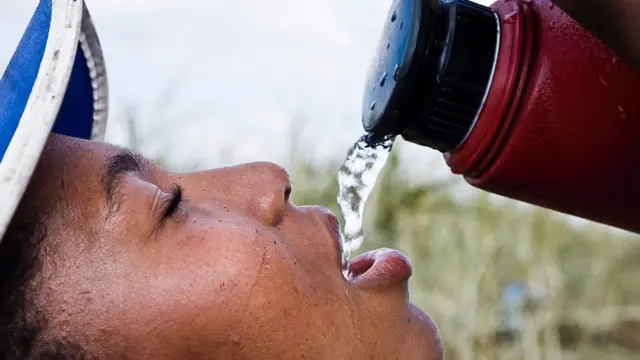 Woman wey dey drink water