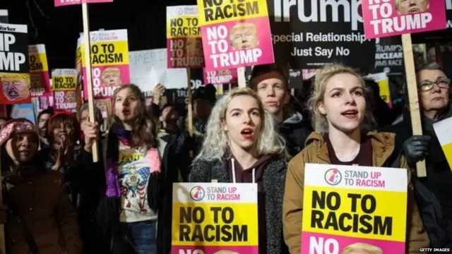 Demonstrators gathered outside the US embassy in London on Friday evening