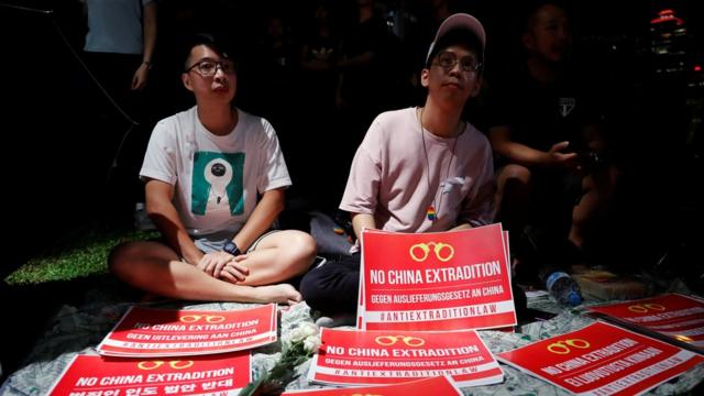 Demonstrators protest to demand authorities scrap a proposed extradition bill with China, in Hong Kong