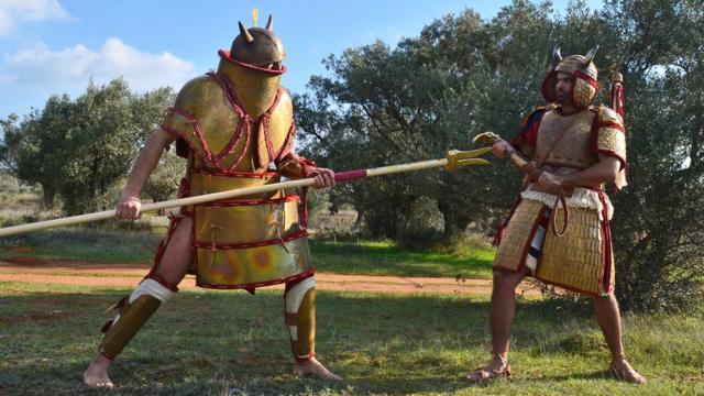 Reenactors dressed as Bronze Age warriors