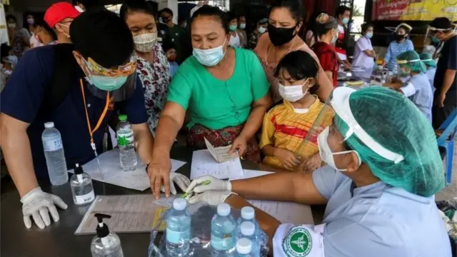 Migrant workers of a seafood market are seen before being tested, amid the coronavirus disease (COVID-19) outbreak, at a seafood market, in Samut Sakhon province, in Thailand, December 19, 2020