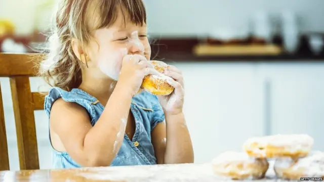 Girl eating a donut