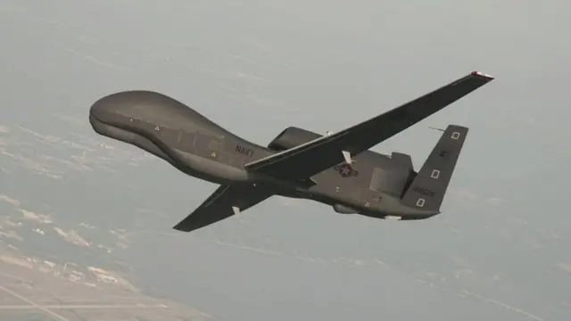 A handout photo made available by the US Navy provided by Northrop Grumman, a RQ-4 Global Hawk unmanned aerial vehicle conducts tests over Naval Air Station Patuxent River, Maryland, USA 25 June 2010