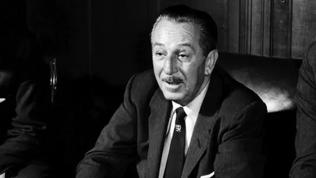 Walt Disney sat on a chair