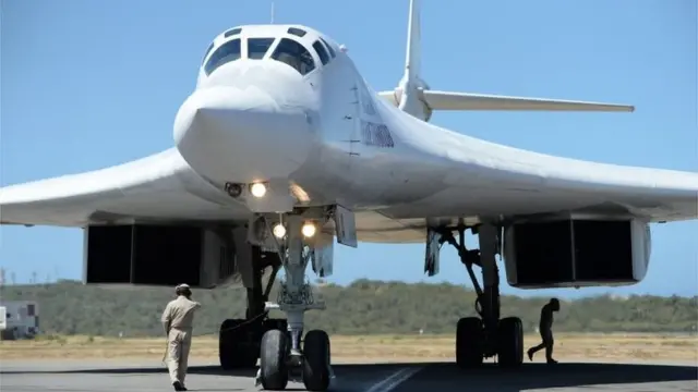 A Russian Tupolev Tu-160 strategic long-range heavy supersonic bomber aircraft is pictured upon landing at Maiquetia International Airport, just north of Caracas, on December 10, 2018