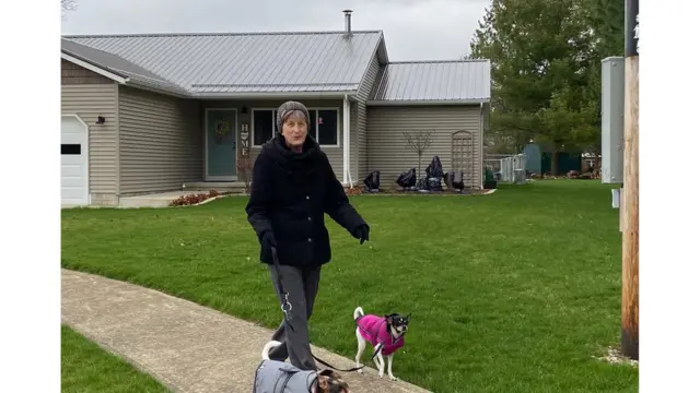 Sheri Thomas walking her dogs