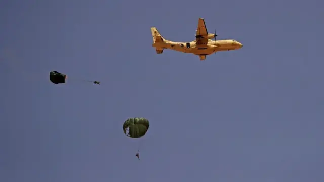 Paratroopers jump off an Egyptian C-130 Hercules military plane during the "Guardians of the Nile" joint military drill between Egypt and Sudan in the Um Sayyala area, northwest of Khartoum, on May 31, 2021
