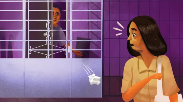 Meri melempar kertas permintaan tolong ke luar gerbang besi yang ditutup setiap saat,