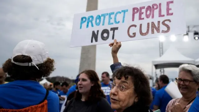 "Protect people not guns" - a sign at a rally in Washington