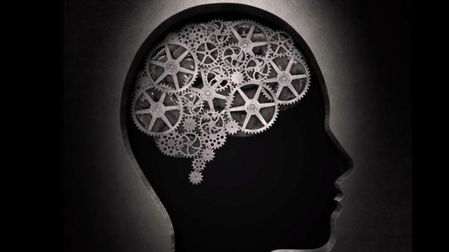 Una ilustración de un cerebro con unos engranajes
