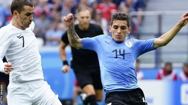 Lucas Torreira in action for Uruguay against France's Antoine Griezmann