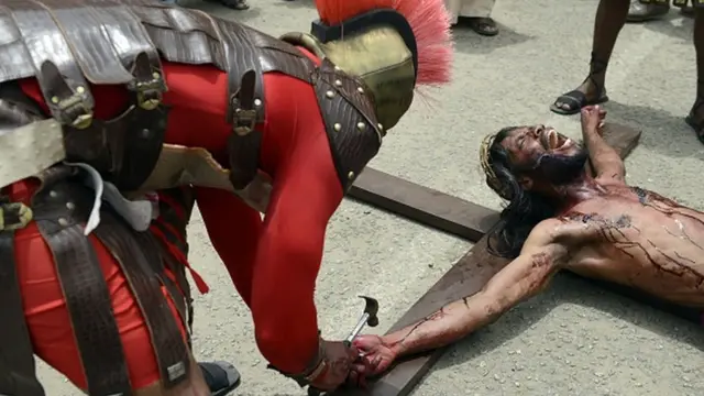 Man wey dem cruxify for cross.