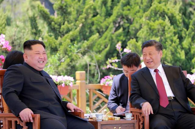 This file picture from North Korea"s official Korean Central News Agency (KCNA) taken on May 8, 2018 and released on May 9 shows China"s President Xi Jinping (R) and North Korean leader Kim Jong Un during a meeting in the Chinese city of Dalian. Dubbed a "world-class poker player" in diplomacy by Donald Trump, Chinese leader Xi Jinping may hold the best cards after the US leader scrapped his planned summit with North Korean leader Kim Jong Un. / AFP PHOTO / KCNA VIA KNS / KCNA VIA KNS