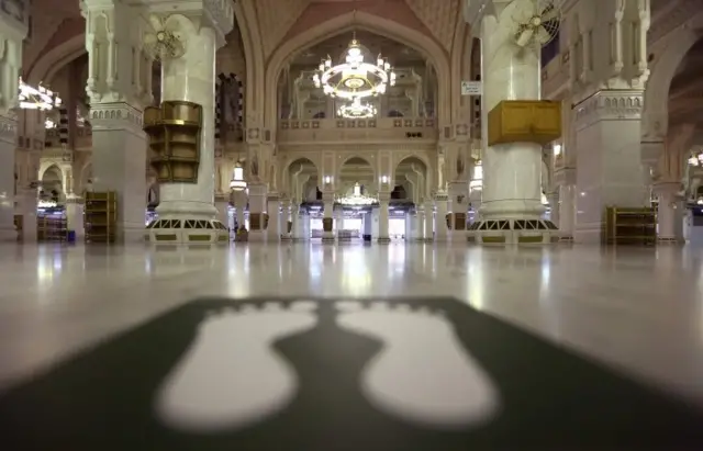 A picture taken on July 27, 2020, shows one of many sticker to indicate safe-distance spots due to the COVID-19 pandemic, on the floor of the Grand Mosque in the holy city of Mecca, in Saudi Arabia, a