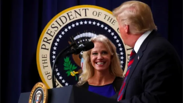 On stage Trump faces a smiling Kellyanne