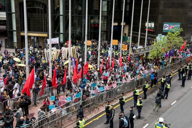 Pro-democracy activists protest outside the venue of the Hong Kong chief executive election in Hong Kong on March 26, 2017