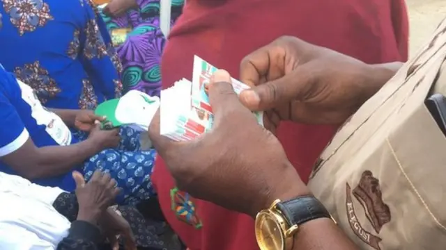 Official hold APC id card to distribute