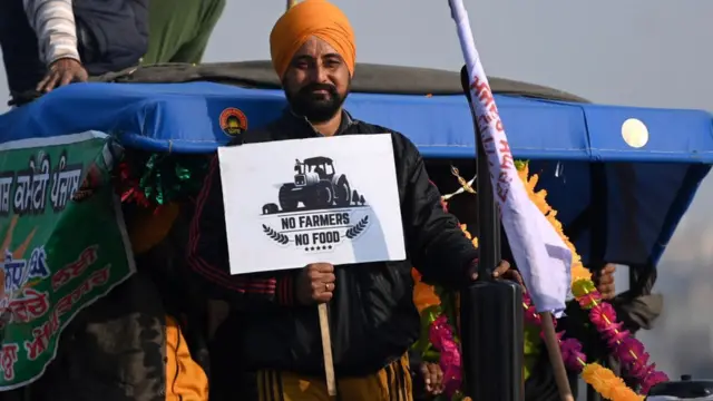 A farmer takes part in a tractor rally as they continue to demonstrate against the central government's recent agricultural reforms in New Delhi on January 26, 2021.
