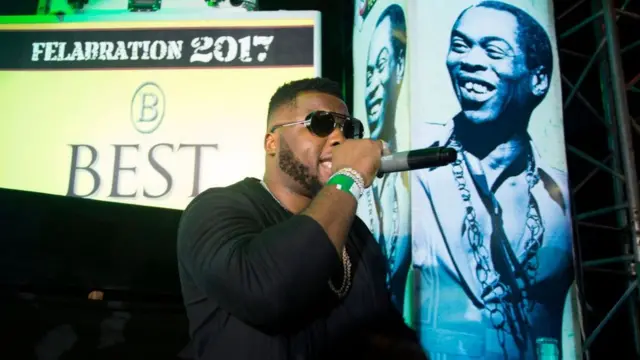 Nigerian musician Dabenja performs at the 'Afrika Shrine' dedicated to the pioneer of Afrobeat, Fela Anikulapo Kuti, during the annual Felabration Musical Concert in Lagos on October 12, 2017.