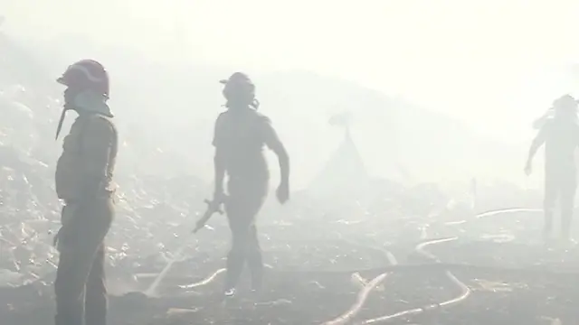 A photo of firefighters at the scene during the 2021 fire