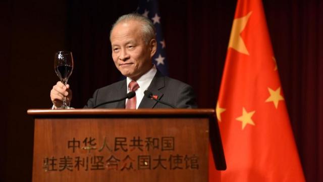 Chinese ambassador - shown at podium