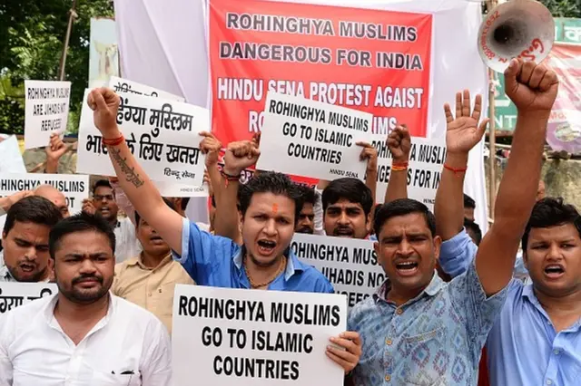 Indian activists from the right-wing organization Hindu Sena hold placards as they shout slogans against Rohingya Muslim refugees being granted asylum in India, in New Delhi on September 11, 2017
