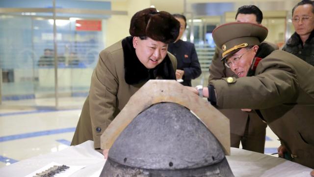 Kim Jong-un looks at what is said to be a rocket warhead shield after a simulated test of atmospheric re-entry, at an unidentified location in an undated photo released by North Korea's Korean Central News Agency (KCNA) in Pyongyang on 15 March 2016.
