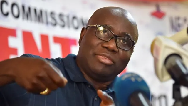 Di oga for di election commission inside Liberia-Jerome Korkoya follow tori people talk during di first round of di election.