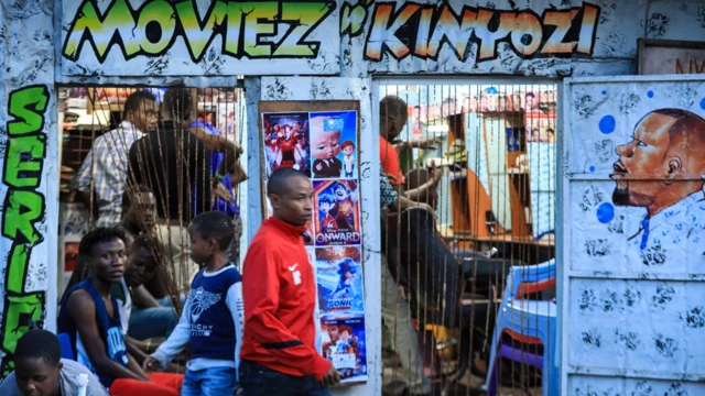 People at a barbershop in Nairobi, Kenya - Tuesday 31 March 2020