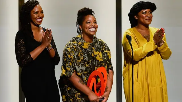 Opal Tometi, Patrisse Cullors, and Alicia Garza accept an award onstage during Glamour Women Of The Year 2016 at NeueHouse Hollywood on 14 November 2016 in Los Angeles, California