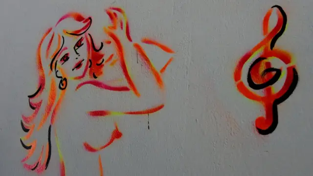 Dibujo en la pared de un bar donde trabajan venezolanas.