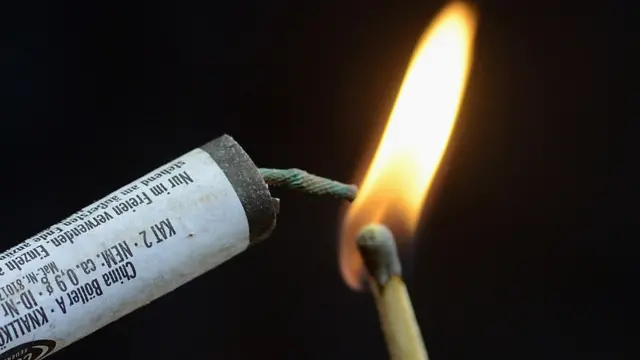 Match lighting a fuse