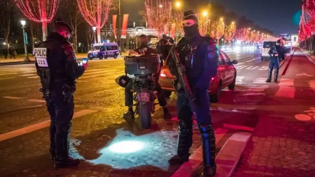 Police are enforcing the curfew in central Paris