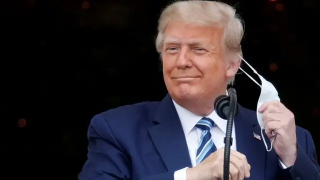 Trump removes mask
