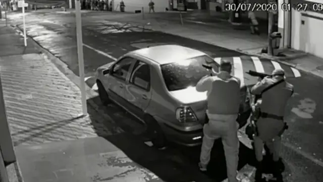 Reproduction from CCTV camera shows police officers in the city of Botucatu in a gunfight with bank robbers earlier this year