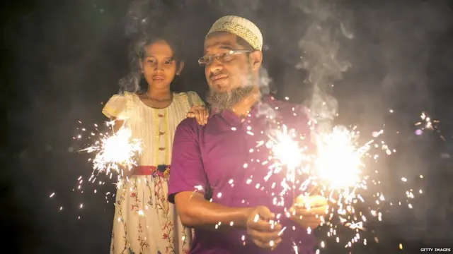 Father Daughter enjoying fire crackers