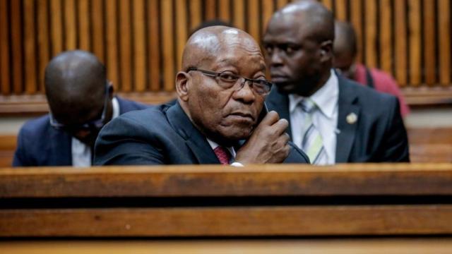 Jacob Zuma speaks on the phone at the Randburg Magistrates Court on October 26, 2018, in Johannesburg