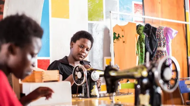 Mafundi wa nguo wakiendelea kushona nguo za watoto za Ki-pepeo Kids mjini kigali