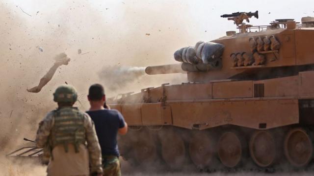 Turkish tank fires a shell during operation in Northern Syria
