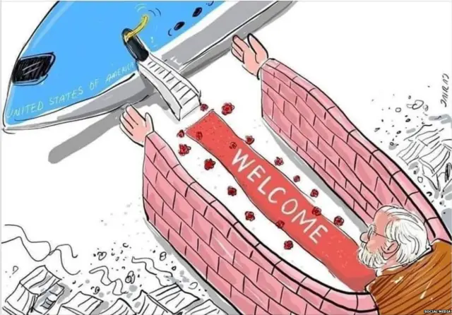 यामध्ये नरेंद्र मोदींच्या बाहू भिंतीच्या आहेत आणि ते या बाहूंद्वारे डोनाल्ड ट्रंप यांचं स्वागत करत आहेत, असं सूचित करण्यात आलंय.