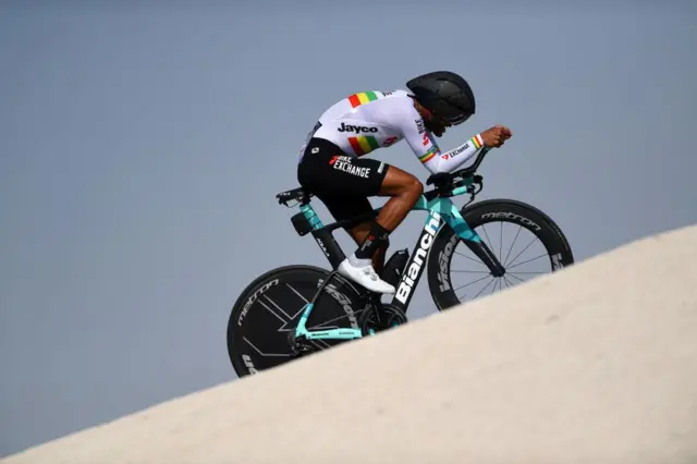 A cycle travels uphill.