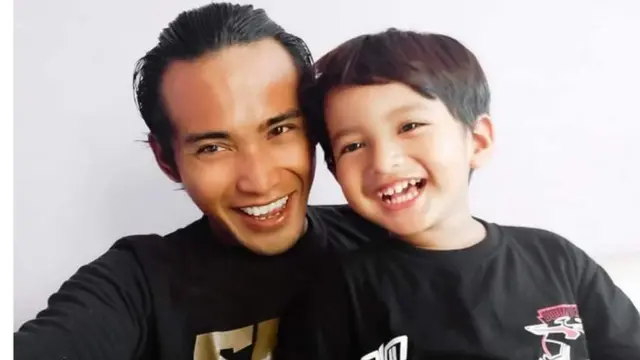 Zulia Mahendra with his son.