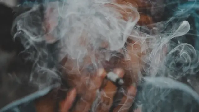 A man smoking a cigarette