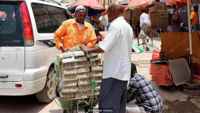 People come with heaps of money Somaliland Schilings to buy goods and services