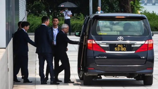 Sam Hou-fai (C), former chief justice of Macau's court of final appeal, leaves the Science Centre after announcing his bid to run for the Chief Executive position, in Macau on August 28, 2024. (Photo by Eduardo Leal / AFP) (Photo by EDUARDO LEAL/AFP via Getty Images)